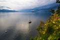Lake Maggiore with boat, Alps hill, Ascona Royalty Free Stock Photo
