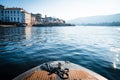 Closeup on a bow of tourist boat while surfing Lake Maggiore with the Borromee Islands in the background