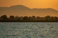 Lake Malawi shore at sunset with orange sky Royalty Free Stock Photo