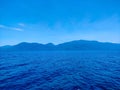 Lake Matano with deep blue water and clear sky