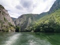 Lake in the Matka canyon - Macedonia. Mountains, emerald water, motor boats. Royalty Free Stock Photo