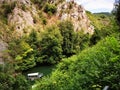 Lake in the Matka canyon - Macedonia. Mountains, emerald water, motor boats Royalty Free Stock Photo