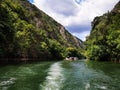 Lake in the Matka canyon - Macedonia. Mountains, emerald water, motor boats. Royalty Free Stock Photo