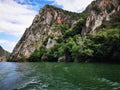 Lake in the Matka canyon - Macedonia. Mountains, emerald water, motor boats Royalty Free Stock Photo