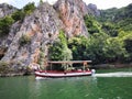 Lake in the Matka canyon - Macedonia. Mountains, emerald water, motor boats. Royalty Free Stock Photo