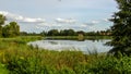 Lake among meadows in Rynia in Poland.