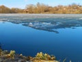 Lake with melting ice in clear day. Royalty Free Stock Photo