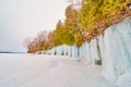 Lake Michigan island cliffs covered in sheets of blue ice in winter Royalty Free Stock Photo