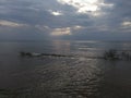 Lake Michigan north point pebbles waves water sky clouds vegetation beach evening view travel hike adventure scenic