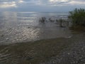 Lake Michigan north point pebbles waves water sky clouds vegetation beach evening view travel hike adventure scenic