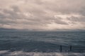 Lake Michigan water rushing over concrete walk