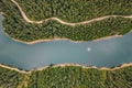 Lake in the middle of the forest as seen from above. Bolboci Lake, Carpathian Mountains, Romania Royalty Free Stock Photo