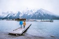 Lake Minnewanka Banff national park Canada, couple walking by the lake during snow storm in October in the Canadian Royalty Free Stock Photo