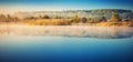 Lake at misty dawn Royalty Free Stock Photo