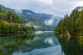 Lake and misty forest in mountains in a rainy day Royalty Free Stock Photo