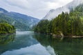 Lake and misty forest in mountains in a rainy day Royalty Free Stock Photo