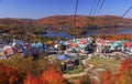 Lake and Mont Tremblant resort in autumn with cable car on the foreground Royalty Free Stock Photo