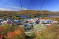 Lake and Mont Tremblant resort in autumn with cable car on the foreground Royalty Free Stock Photo