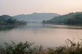 The lake in the morning light that the sun is rising There is a mountain back view Royalty Free Stock Photo