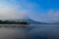 Lake and mountain with morning mist Royalty Free Stock Photo