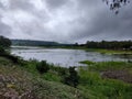 Overcast Dark Clouds above on the Lake Royalty Free Stock Photo