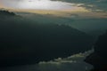 Lake and mountains in moody morning. Royalty Free Stock Photo