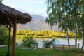 Lake in the mountains. Quiet bay in the greenery at sunset. Place for rest. Kyrgyzstan, Lake Issyk-Kul Royalty Free Stock Photo