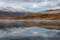 Lake mountains reflection snow sunrise Royalty Free Stock Photo