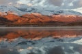 Lake mountains reflection snow sunrise Royalty Free Stock Photo