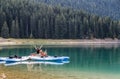 Black Lake in Durmitor national park, Montenegro, boats on the lake. Royalty Free Stock Photo