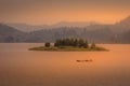 Lake Mutanda at sunset with view on the volcanoes mount Muhavuru and mount Gahinga in East Africa, along the border of Rwanda and