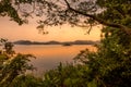 Lake Mutanda at sunset with view on the volcanoes mount Muhavuru and mount Gahinga in East Africa, along the border of Rwanda and