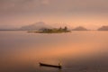 Lake Mutanda at sunset with view on the volcanoes mount Muhavuru and mount Gahinga in East Africa, along the border of Rwanda and