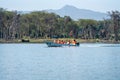 Tourists on a speedboat boating safari to Crescent Island Royalty Free Stock Photo