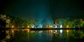 Lake night scene with windmills.