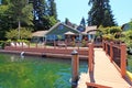 Lake one story house with dock. Royalty Free Stock Photo