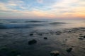 Lake Ontario sunset with smoothed water over rocks