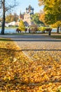 lake with the Orthodox Church and the Christian Church and the picturesque autumn landscape with yellow leaves