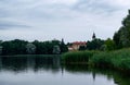 Lake overlooking the ancient castle of the Radziwills Nesvizh, Belarus. Beautiful summer landscape with architectural elements