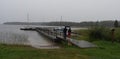 Lake, pier with sailing boats during the rain Royalty Free Stock Photo