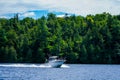 Boaters enjoy summer day on Lake Placid in New York State`s Adirondack Mountains