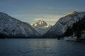 Lake plansee between snowy alpine mountains