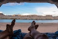 Lake Powell - Leg of couple lying in camper van with panoramic sunset view of Wahweap Bay at Lake Powell, Utah, USA Royalty Free Stock Photo