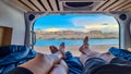 Lake Powell - Legs of couple lying in camper van with panoramic sunset view of Wahweap Bay at Lake Powell, Utah, USA Royalty Free Stock Photo