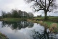 Lake and reflection of a tranquil farm in Meon Springs England