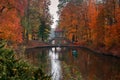 Lake reflections of fall foliage and ancient bridge in Ukraine Royalty Free Stock Photo