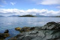 Shore with rocks on lake in National Park Tierra del Fuego with  in Patagonia, Provincia de Tierra del Fuego, Argentina Royalty Free Stock Photo