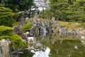 Lake and rocks of Japanese garden Royalty Free Stock Photo