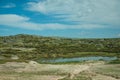 Lake on rocky landscape with domes of an old radar station Royalty Free Stock Photo