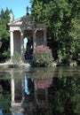 Lake and roman temple of esculapioin a park in Rome